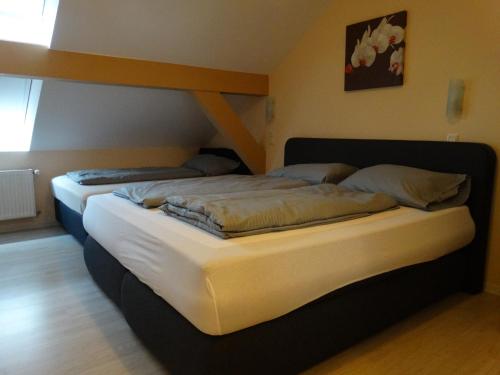 Postel nebo postele na pokoji v ubytování Hotel Amy