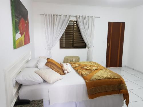 Lova arba lovos apgyvendinimo įstaigoje Pluma Hotel Cidade