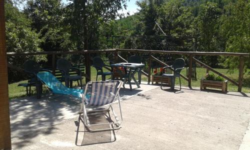 a group of chairs and tables on a patio at Agriturismo Rio Ricco in Busana