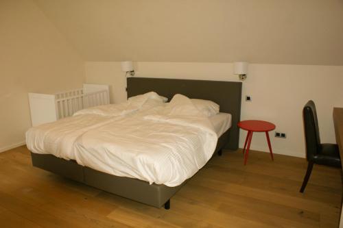 Кровать или кровати в номере De Goudmijn