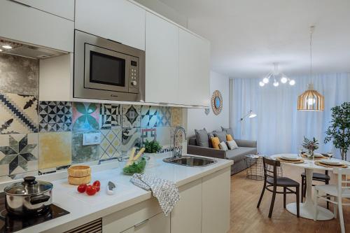 a kitchen and living room with a counter top at MYA home General Vives in Las Palmas de Gran Canaria