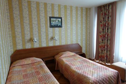 Ένα ή περισσότερα κρεβάτια σε δωμάτιο στο Olymp Hotel