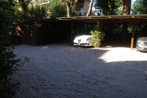 a garage with a car parked under it at Affittacamere Villa Wilson in Rome