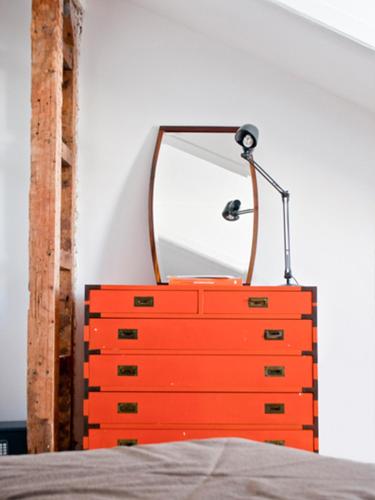 a red dresser with a mirror on top of it at Independente Príncipe Real in Lisbon