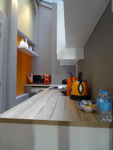 a kitchen with a wooden counter top in a room at Suite 11 in Antwerp