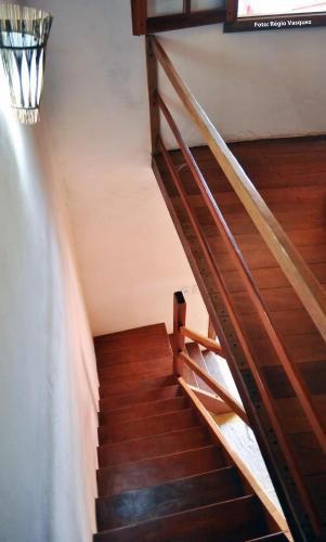 a staircase in a house with wood flooring at Casas da Bete in Trancoso