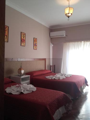 A bed or beds in a room at Posada La Casona