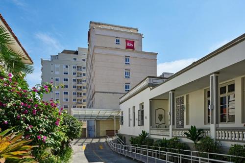 a large building with a sign on the side of it at ibis Curitiba Batel in Curitiba