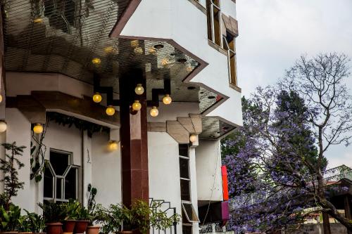 a building with lights on the side of it at Hotel Pegasus Crown in Shillong