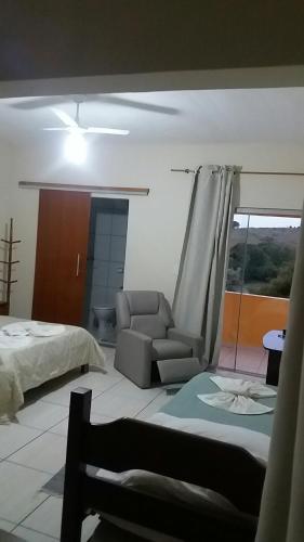 Ένα ή περισσότερα κρεβάτια σε δωμάτιο στο Pousada dos Tucanos