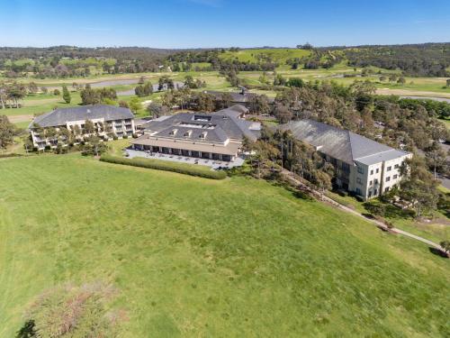 an aerial view of a large building on a green field at Yarra Valley Lodge in Wonga Park
