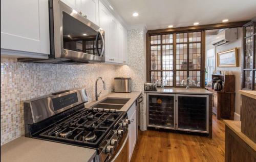 a kitchen with a stove top oven in a kitchen at The Clarendon House in Provincetown