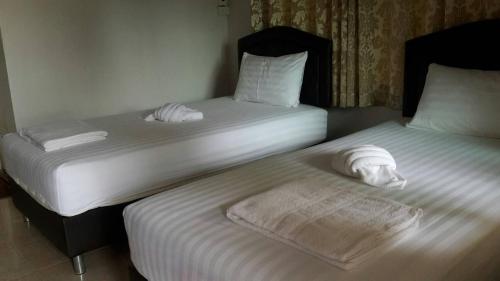 En eller flere senge i et værelse på Rubtawan Sichang Resort