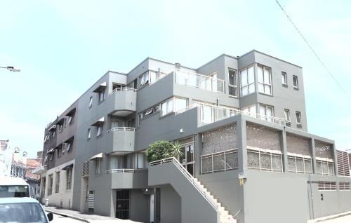 a gray building with a staircase in front of it at Cityview Studio Accommodation in Sydney