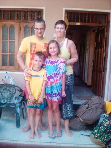 a group of people standing in front of a house at Sagopearl Guest in Mirissa