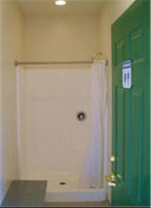 a room with a green door and a white wall at Zion Ponderosa Ranch Resort in Springdale