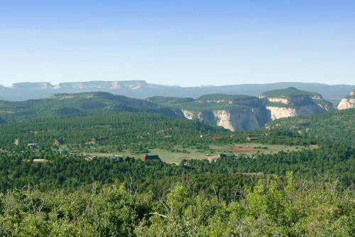 a view of a valley with trees and mountains at Zion Ponderosa Ranch Resort in Springdale