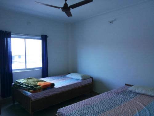Postelja oz. postelje v sobi nastanitve Bodhgaya Guest House