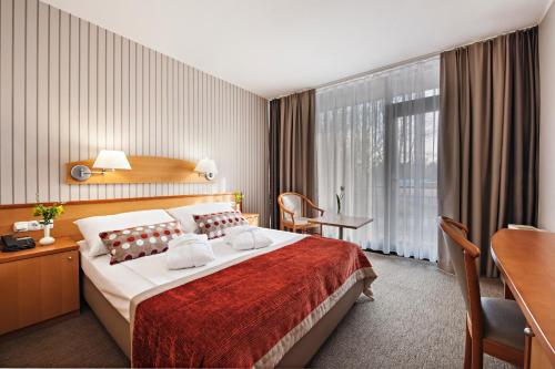 Hotel Termal - Terme 3000 - Sava Hotels & Resorts tesisinde bir odada yatak veya yataklar