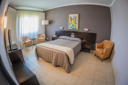Postel nebo postele na pokoji v ubytování Hotel Gran Sol
