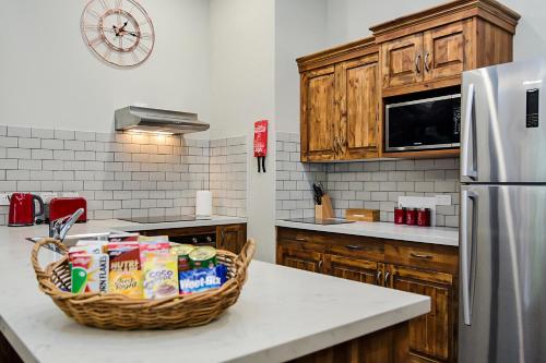 a kitchen with a basket of food on a counter at Eagle Foundry Bed & Breakfast in Gawler