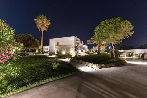 a home at night with lights on the driveway at White Pearls-Adults Only Luxury Suites in Kos Town