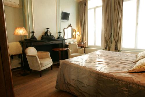 Postel nebo postele na pokoji v ubytování Hotel Jan Brito
