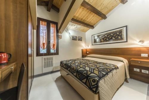 Postel nebo postele na pokoji v ubytování Traldi Resort