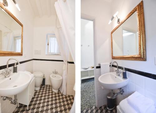 bagno con lavandino, servizi igienici e specchio di Dreaming Apartments Lucca Leonardo a Lucca