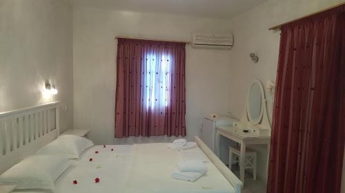 Ένα ή περισσότερα κρεβάτια σε δωμάτιο στο Hotel Sagterra 
