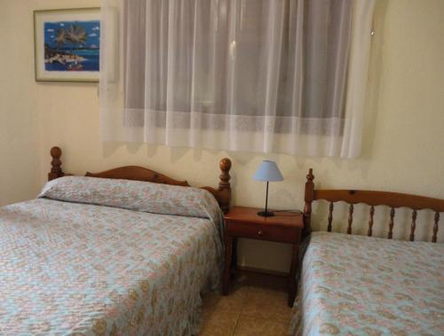 Postel nebo postele na pokoji v ubytování Résidence de la Baie