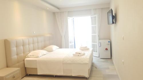 Ένα ή περισσότερα κρεβάτια σε δωμάτιο στο Hotel Sagterra 