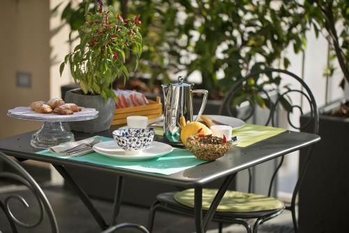 a table with a plate of food on it at Accademia 39 in Sorrento
