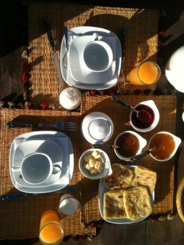 a table topped with plates and bowls of food at Dar Bhija in Fès