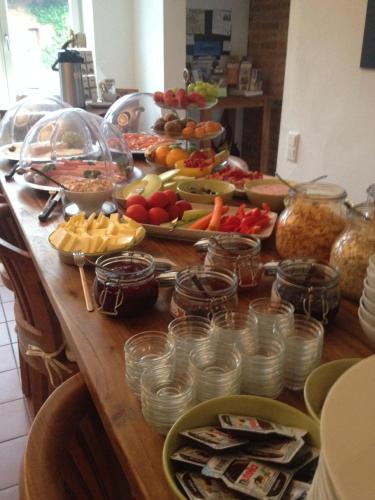 a table with a bunch of food on it at To`n Schlagboom in Wangerland
