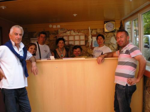 a group of people standing around a counter at Sinter Terasse House Hotel in Pamukkale