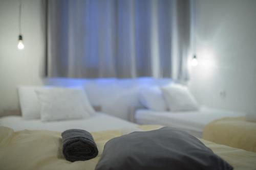 a bed with a towel on it in a room at Apartment Raza in Konjic