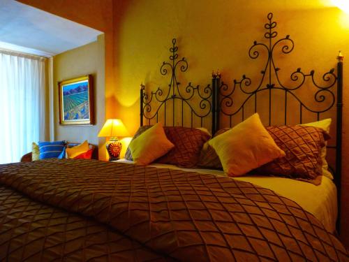 a bedroom with a large bed in a room at Casa Calderoni in San Miguel de Allende