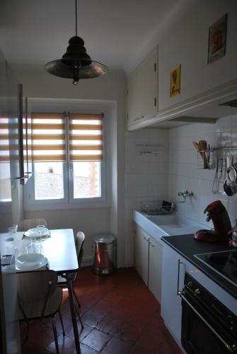 a kitchen with a table and a small table and a tableablish at cal erre in Céret