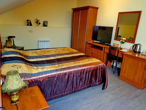 
Кровать или кровати в номере Hotel Guberniya
