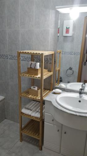 a bathroom with a sink and a white sink at Workspace.job in Portimão