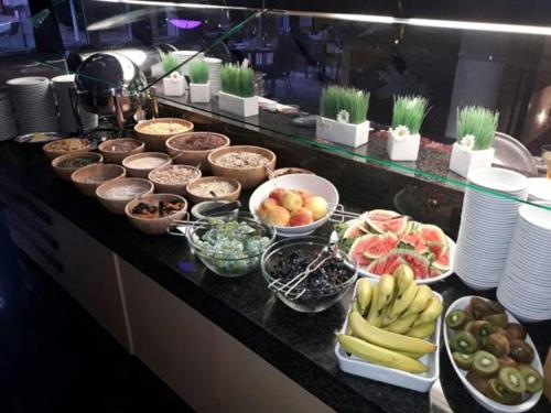 a buffet with many different types of food on a counter at TRYP by Wyndham Halle in Halle an der Saale