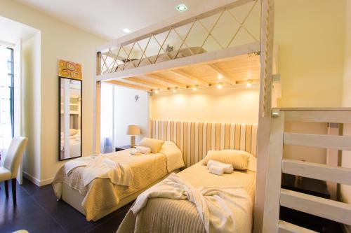 Postel nebo postele na pokoji v ubytování Downtown Apartments Bica