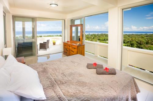 Postel nebo postele na pokoji v ubytování Mai'I Villa Apartments