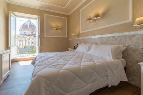 Postel nebo postele na pokoji v ubytování Hotel California