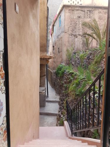 an alley with a stairway leading up to a building at Dar Amadine in Imlil