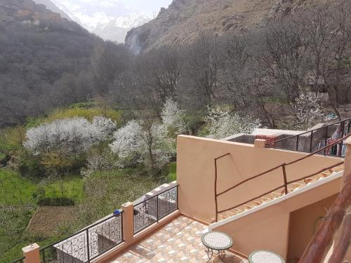 a balcony with a view of the mountains at Dar Amadine in Imlil