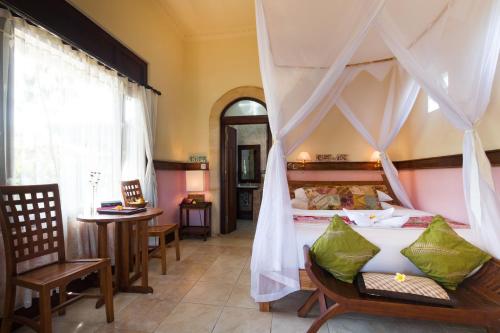 Ένα ή περισσότερα κρεβάτια σε δωμάτιο στο Ubud Aura Wellness Sanctuary