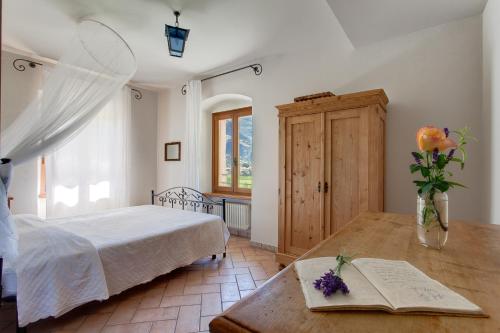Postel nebo postele na pokoji v ubytování Agriturismo Maso Lizzone