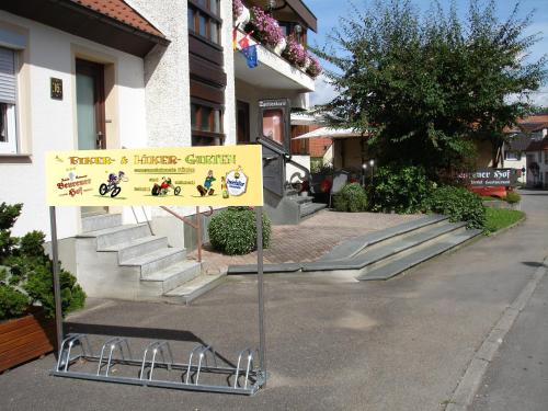 a sign in the street in front of a building at Beurener Hof in Beuren